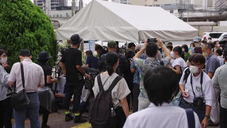 People-at-memorial-Site-of-Shinzo-Abe,-Japanese-former-prime-minister