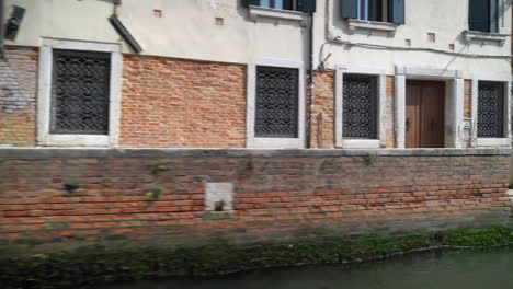 Daytime-Scene-From-A-Boat-Sailing-At-The-Grand-Canal-In-Venice,-Italy,-POV