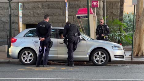 Armed-police-officers-on-duty-asked-dangerous-driver-to-pullover-on-the-roadside-for-further-investigation-on-alcohol-level,-improper-use-of-seat-belt-and-illegal-parking-at-downtown-Brisbane-city