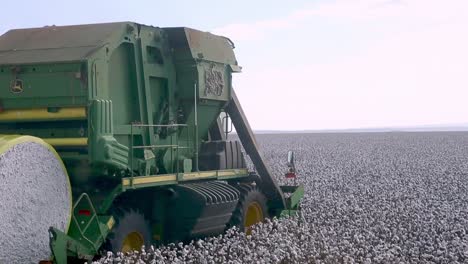 Driving-in-the-shaky-cabin-of-a-tractor-harvester-cotton-picker-in-formation-alongside-another