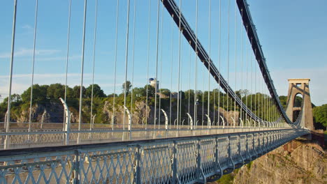 Hot-Air-Balloons-in-Flight-Over-Clifton-Suspension-Bridge,-Bristol,-UK---Wide-Perspective-Shot---Time-lapse