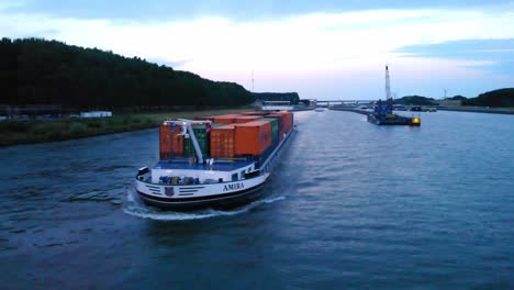 Aerial-View-Off-Forward-Bow-Of-Amira-Inland-Cargo-Container-Ship-Along-Hollands-Diep-On-Overcast-Moody-Day