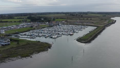 High-angle-over-moored-boats-on-a-cool-autumn-evening-in-Bradwell-Essex