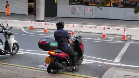 Canary-Wharf-London-England-August-2022-fast-food-delivery-driver-starts-his-journey