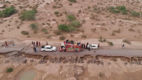 Aerial-Truck-Providing-Food-Aid-After-Flood-In-Remote-Area-In-Balochistan