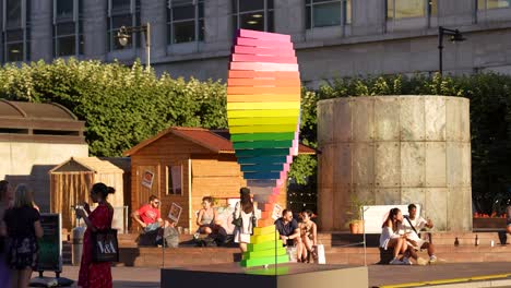 Canary-Wharf-London-England-June-2022-Pride-tribute-sculpture-rotating-by-the-Cabot-Square-fountain