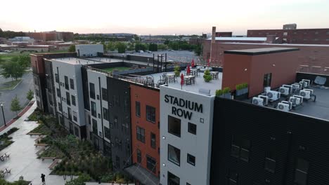Stadium-Row,-new-modern-apartment-building-with-outdoor-rooftop-tables-and-seating