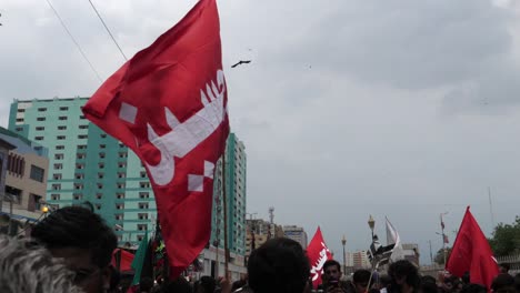 When-Muharram,-also-known-as-Muharram-Ul-Haram,-the-first-month-of-the-Islamic-calendar,-is-celebrated-with-a-parade,-various-colored-flags-are-raised