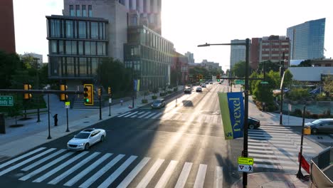 Sun-shining-brightly-behind-Drexel-University-banner-on-campus