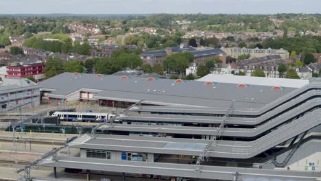 Reading-United-Kingdom-July-2022-Aerial-establishing-shot-of-train-pulling-into-reading-train-station