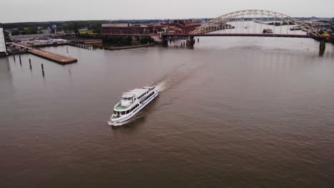 Aerial-Overhead-View-Of-Smaragd1-Party-ship-Going-Past-On-River-Noord