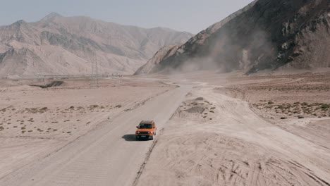 Jeep-Renegade-Longitude-travel-down-the-dirt-road-in-canyon,-commercial-ad-video
