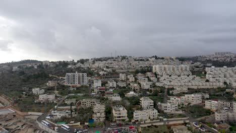 Jerusalem-white-building-neighborhood,-orthodox-jew,-cloudy-day,-shot-with-a-drone