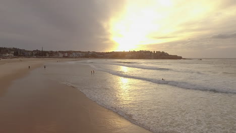 A-group-of-Women-doing-Yoga-on-the-beach-shortly-after-sunrise