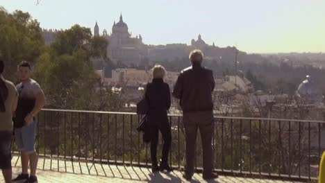 Tourists-watching-Madrid-skyline,-Palacio-Real-and-Catedral-de-la-Almudena