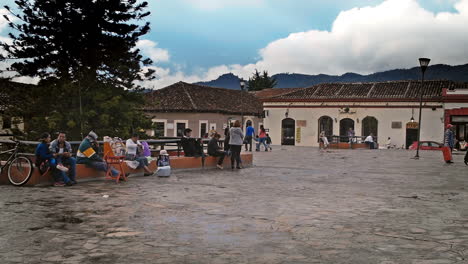 MAIN-CATHEDRAL-SQARE-IN-SAN-CRISTOBAL-DE-LAS-CASAS,-CHIAPAS-MEXICO-SHOT-PEOPLE-PASSING-BY