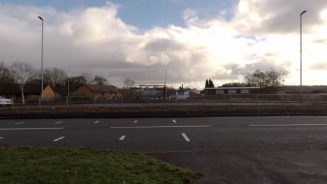 Cars-travel-past-a-speed-camera-near-the-city-centre,-slowing-down-as-they-pass-the-camera,-safe-driving