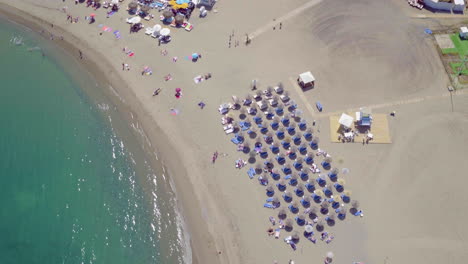 Birds-eye-view-of-the-beach-and-the-harbor-with-luxurious-boats-in-Puerto-Banus,-Marbella