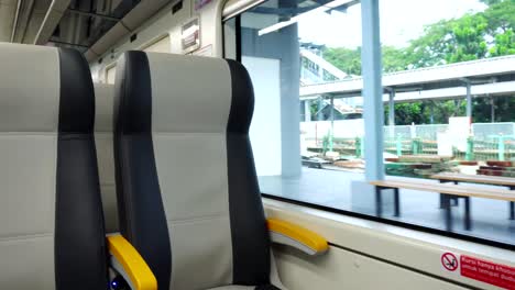 empty-seat-inside-airport-train-cabin