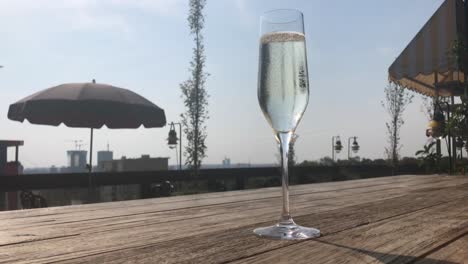 One-classy-glass-of-cooled-Italian-sparkling-wine-with-city-panoramic-view