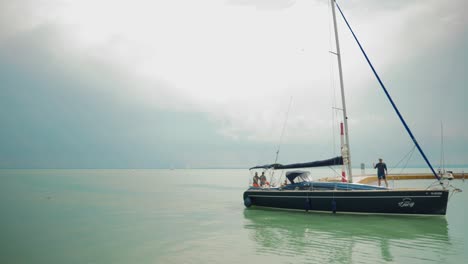 Black-boat-is-arriving-to-the-docks-by-afternoon