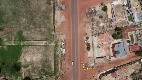 Aerial-view-over-Kololi-Road-and-Manjai-football-field-in-Serrekunda-The-Gambia-Africa
