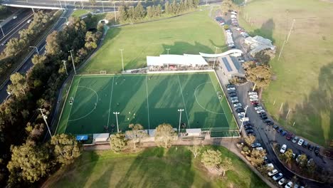 Rising-up-and-out-drone-footage-during-a-break-in-a-men's-premier-league-field-hockey-match-at-Elgar-Park