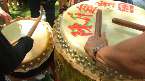 Percussion-close-up-view,-people-playing-rhythm-music-instrument,-drum-rolls,-tam-tam,-djembe,-tambour-and-sticks