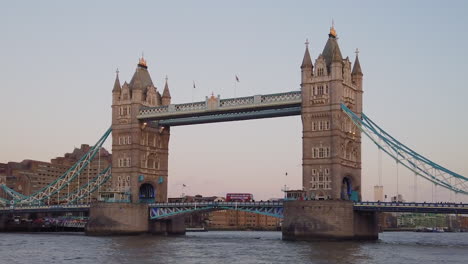 View-of-the-iconic-landmark-Tower-Bridge-with-red-British-bus