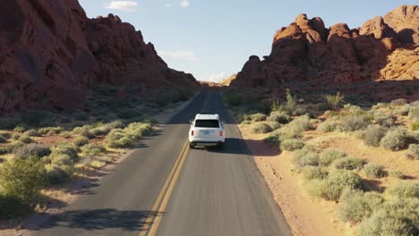 White-Rolls-Royce-on-the-open-road-in-the-Valley-of-Fire,-Nevada