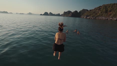 Girl-Doing-a-Cannon-Ball-into-the-Water-at-Halong-Bay