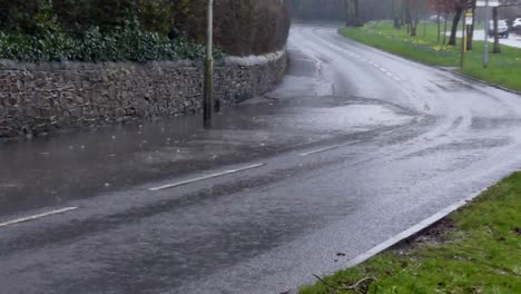 Cars-driving-and-splashing-through-flooded-stormy-severe-flash-flood-road-corner