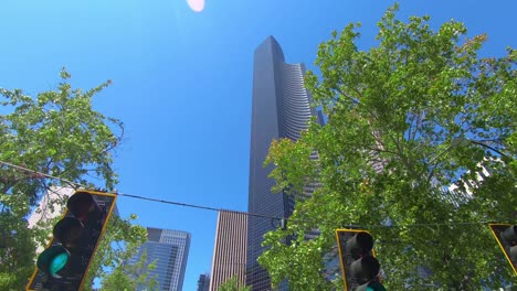 Driving-with-a-look-to-massive-and-huge-modern-buildings-in-Seattle-and-blue-summer-sky