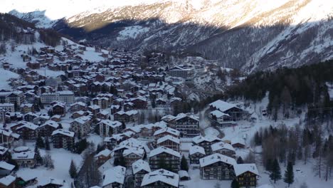 Aerial-of-idyllic-winter-town-in-the-Swiss-mountains