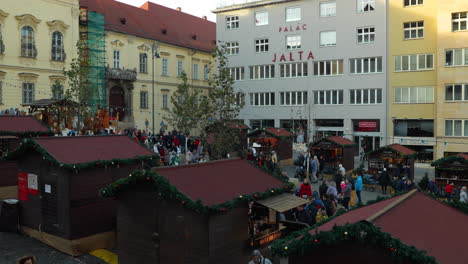 Crowds-of-people-during-Christmas-holidays-in-the-city-of-Brno-flowing-past-kiosks-and-events-on-the-Dominican-Square-during-the-day-captured-at-4k-60fps-slow-motion