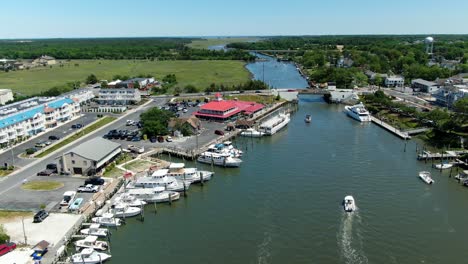 AERIAL-SLOW-MOTION-Lewes-Canal-Marina,-Delaware-And-Docklands