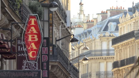 Traditional-illuminated-Tabac-or-Tobbaco-shop-sign-near-Champs-Elysee,-Paris,-France