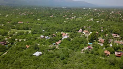 Aerial-view-of-the-tourist-town-Merlo-with-the-mountains-of-Córdoba-behind,-Argentina