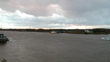 Empty-freight-ship-entering-harbor-on-the-Schelde-river-in-Antwerp,-Belgium