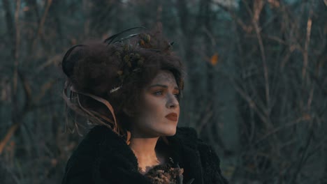 Mysterious-Woman-In-Black-Coat-With-Messy-Hair-Wandering-Around-The-Forest---Slow-Motion