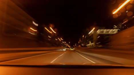Hyperlapse-of-a-tunnel-drive-with-a-car,-front-view-through-the-windshield-with-speed-blurry-effects