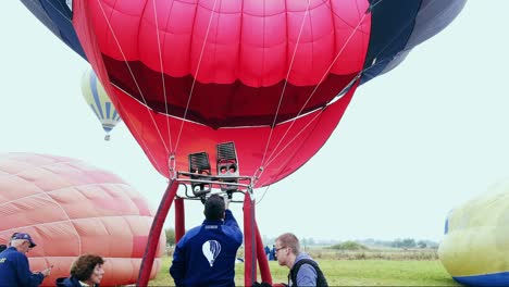 Hot-Air-Balloon-inflated-by-its-crew-during-Hot-Air-Balloon-Parade-in-Romania