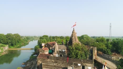 ancient-Indian-temple,-Varanasi-city-with-ancient-architecture,-View-of-the-holy-Manikarnika-ghat-at-Varanasi-India-at-sunset