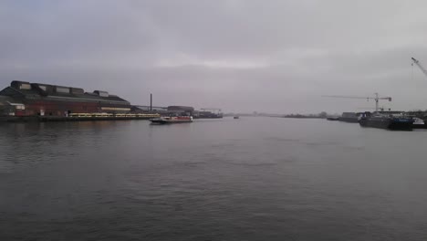 Quiet-Scene-In-A-Harbor-By-The-River-On-A-Gloomy-Afternoon---panning-shot