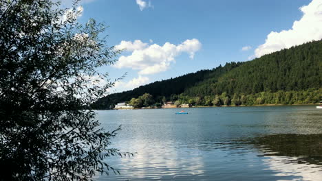 Clip-of-the-Pancharevo-lake-during-a-sunny-day,-with-a-kayak-sailing