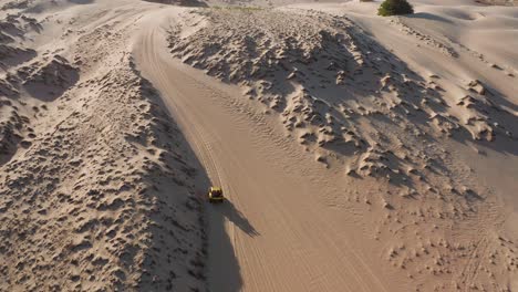 Aerial:-Buggy-driving-through-the-dunes-of-Cumbuco