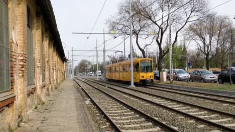 Empty-yellow-electric-tram-on-railroad-tracks-in-Budapest-Hungary