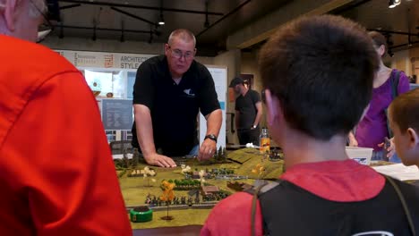 Adults-teach-young-people-how-to-play-tactical-civil-war-gaming