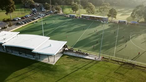 Panning-from-left-to-right-drone-footage-over-men's-premier-league-field-hockey-match-at-Elgar-Park