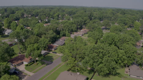 aerial-pan-left-and-right-over-suburban-homes-and-neighborhood-on-a-summer-day